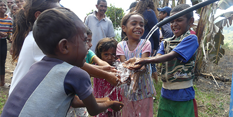 Children from Biluli, Timor-Leste, celebrate the installation of clean water in their village (Jesuit Mission)