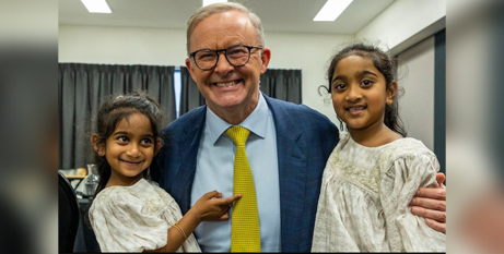 Anthony Albanese with Tharnicaa and Kopek Nadesalingam, whose family were granted bridging visas in June to stay in Australia (Twitter/AlboMP)